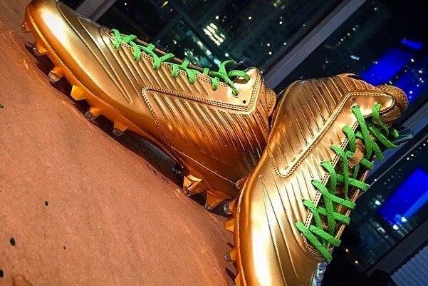 gold bottom cleats