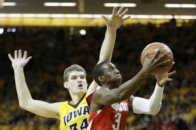 Ohio State guard Shannon Scott drives to the basket past Iowa center Adam Woodbury, left, during the first half of an NCAA college basketball game, Saturday, Jan. 17, 2015, in Iowa City, Iowa. (AP Photo/Charlie Neibergall)