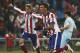Atletico's Mario Mandzukic, centre, celebrates his goal with teammate Fernando Torres, left, during a Spanish La Liga soccer match between Atletico Madrid and Granada at the Vicente Calderon stadium in Madrid, Spain, Sunday, Jan. 18, 2015. (AP Photo/Andres Kudacki)