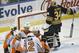 Philadelphia Flyers Wayne Simmonds (17), Zac Rinaldo (36), Luke Schenn (22) and Michael Del Zotto (15) celebrate the game-winning goal by Michael Raffl (12) as Buffalo Sabres Michal Neuvirth (34) reacts during the third period of an NHL hockey game Saturday, Jan. 17, 2015, in Buffalo, N.Y. Philadelphia won 4-3. (AP Photo/Gary Wiepert)