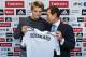 Norway international soccer player Martin Odegaard, left, poses with Real Madrid's representative Emilio Butragueno, during his official presentation in Madrid, Spain, Thursday, Jan. 22, 2015, after signing for Real Madrid. (AP Photo/Andres Kudacki)