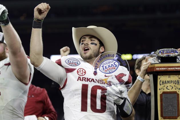 Arkansas quarterback Brandon Allen (10) cheers with fans after winning the Texas Bowl NCAA college football game against Texas Monday, Dec. 29, 2014, in Houston. Arkansas won 31-7. (AP Photo/David J. Phillip)