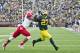 Miami (Ohio) defensive back Quinten Rollins, left, tries to stop Michigan running back Derrick Green (27) rushing for a touchdown in the fourth quarter of an NCAA college football game in Ann Arbor, Mich., Saturday, Sept. 13, 2014. (AP Photo/Tony Ding)