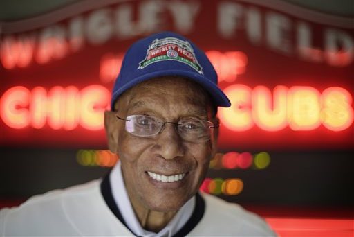 FILE - In this March 24, 2014, file photo Chicago Cubs Hall of Fame slugger Ernie Banks smiles after an interview at the Cubs offices in Chicago. The Cubs announced Friday night, Jan. 23, 2015, that Banks had died. He was 83. (AP Photo/M. Spencer Green, File)