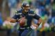 SEATTLE, WA - NOVEMBER 02: Quarterback Russell Wilson #3 of the Seattle Seahawks rolls out to pass against the Oakland Raiders at CenturyLink Field on November 2, 2014 in Seattle, Washington. (Photo by Otto Greule Jr/Getty Images)
