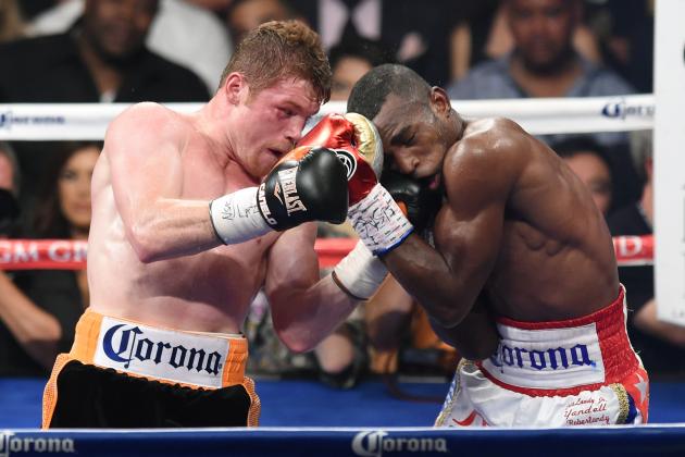 LAS VEGAS, NV - JULY 12:  Canelo Alvarez (L) hits Erislandy Lara in the fifth round of their junior middleweight bout at the MGM Grand Garden Arena on July 12, 2014 in Las Vegas, Nevada. Alvarez won in a split decision.  (Photo by Ethan Miller/Getty Images)