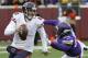 Chicago Bears quarterback Jay Cutler runs from Minnesota Vikings defensive tackle Tom Johnson, right, during the second half of an NFL football game, Sunday, Dec. 28, 2014, in Minneapolis. The Vikings won 13-9. (AP Photo/Ann Heisenfelt)