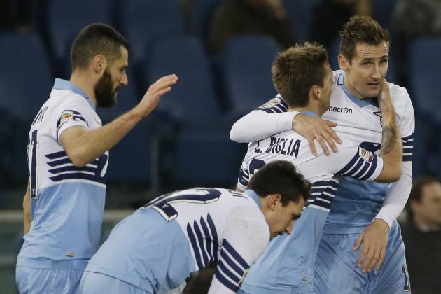 Lazio's Miroslav Klose, right, celebrates  with teammates after scoring during a Serie A soccer match between Lazio and AC Milan in Rome's Olympic stadium, Saturday, Jan. 24, 2015. (AP Photo/Gregorio Borgia)