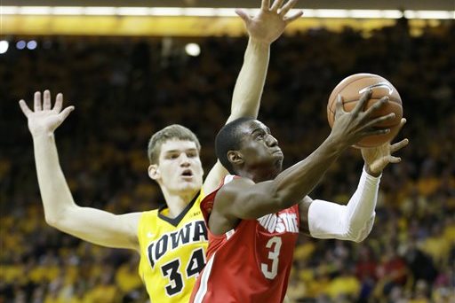 Ohio State guard Shannon Scott drives to the basket past Iowa center Adam Woodbury, left, during the first half of an NCAA college basketball game, Saturday, Jan. 17, 2015, in Iowa City, Iowa. (AP Photo/Charlie Neibergall)