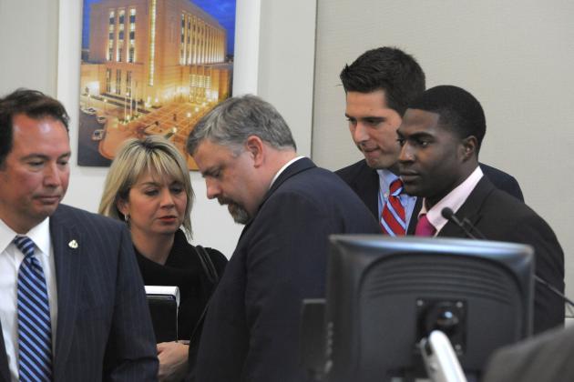 The defense gatherers after the jury was read the charges against Brandon Vandenburg and Cory Batey on Tuesday, Jan. 27, 2015 in Nashville, Tenn.  Vandenburg and Batey, two former Vanderbilt football players,  are each charged with five counts of aggravated rape and two counts of aggravated sexual battery. (AP Photo/The Tennessean, John Partipilo, Pool)