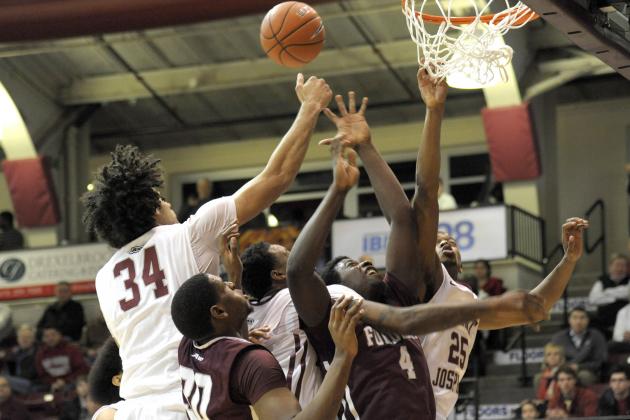 Jan 14, 2015; Philadelphia, PA, USA; Saint Joseph's Hawks forward Javon Baumann (34), guard Chris Wilson (24) and forward James Demery (25) battle with Fordham Rams forward Ryan Rhoomes (30) and guard Eric Paschall (4) for rebound during the first half at Hagan Arena. Mandatory Credit: Eric Hartline-USA TODAY Sports