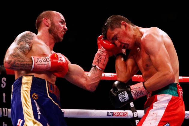 LONDON, ENGLAND - JANUARY 31:  Kevin Mitchell (L) of England lands a punch on Daniel Estrada of Mexico during their the WBC Silver Lightweight Title fight held at O2 Arena on January 31, 2015 in London, England.  (Photo by Dean Mouhtaropoulos/Getty Images)