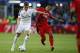 Real Madrid’s Toni Kroos fights for the ball with Sevilla’s Carlos Bacca, left, during the UEFA Super Cup soccer match between Real Madrid and Sevilla in Cardiff City Stadium, in Cardiff, Wales, Tuesday, Aug. 12, 2014. (AP Photo/Alastair Grant)