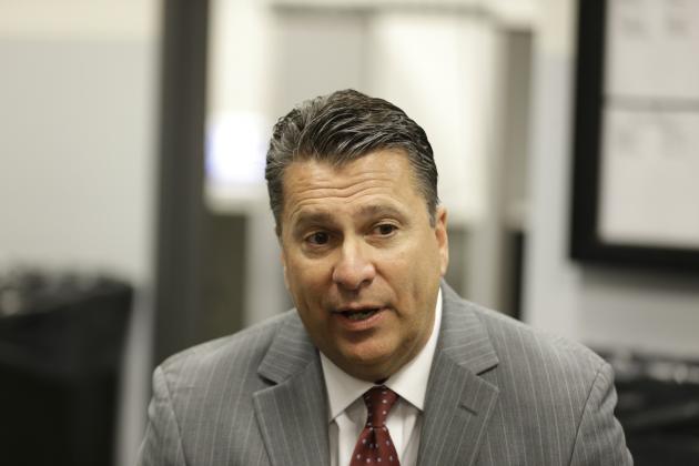 Fordham head coach for men's basketball Tom Pecora talks to reporters during the Atlantic 10 media day in New York, Tuesday, Oct. 14, 2014. (AP Photo/Seth Wenig)