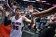 Jan 28, 2015; Atlanta, GA, USA; Atlanta Hawks guard Kyle Korver (26) celebrates with fans after their win over the Brooklyn Nets at Philips Arena. The Hawks won 113-102. Mandatory Credit: Jason Getz-USA TODAY Sports
