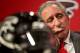 Atlanta Falcons owner Arthur Blank looks on during a news conference introducing former Seattle Seahawks defensive coordinator Dan Quinn as the NFL football team's new head coach, Tuesday, Feb. 3, 2015, in Flowery Branch, Ga. After the news conference Blank responded to the NFL’s investigation there was fake crowd noise pumped into home games. He said “what we’ve done in 2013 and 2014 was wrong” and said he expects results of the league’s investigation in a few weeks. The Falcons could be fined or penalized with the loss of a draft pick by the league. (AP Photo/John Bazemore)