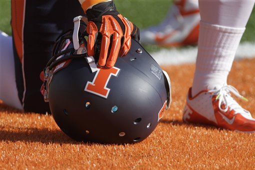 An Illinois football helmet with logo is seen during the first half of an NCAA college football game against Indiana Saturday, Oct. 27, 2012 in Champaign, Ill. (AP Photo/Seth Perlman)