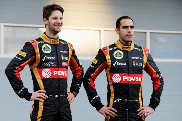 BAHRAIN, BAHRAIN - FEBRUARY 20:  Pastor Maldonado (R) of Venezuela and Lotus and Romain Grosjean (L) of France and Lotus stand with the new Lotus E22 following day two of Formula One Winter Testing at the Bahrain International Circuit on February 20, 2014 in Bahrain, Bahrain.  (Photo by Andrew Hone/Getty Images)