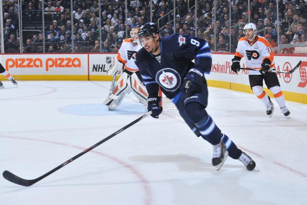 WINNIPEG, CANADA - DECEMBER 21: Evander Kane #9 of the Winnipeg Jets follows the play up the ice during first period action against the Philadelphia Flyers on December 21, 2014 at the MTS Centre in Winnipeg, Manitoba, Canada. The Flyers defeated the Jets 4-3 in overtime. (Photo by Lance Thomson/NHLI via Getty Images)