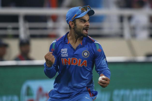 India's Virat Kohli celebrates taking the catch to dismiss Sri Lanka's batsman Tillakaratne Dilshan during their ICC Twenty20 Cricket World Cup final match in Dhaka, Bangladesh, Sunday, April 6, 2014. (AP Photo/Aijaz Rahi)