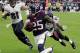 Houston Texans cornerback Kareem Jackson (25) runs back an interception as Baltimore Ravens tight end Owen Daniels (81) and wide receiver Torrey Smith (82) defend during the second half of an NFL football game Sunday, Dec. 21, 2014, in Houston. (AP Photo/David J. Phillip)