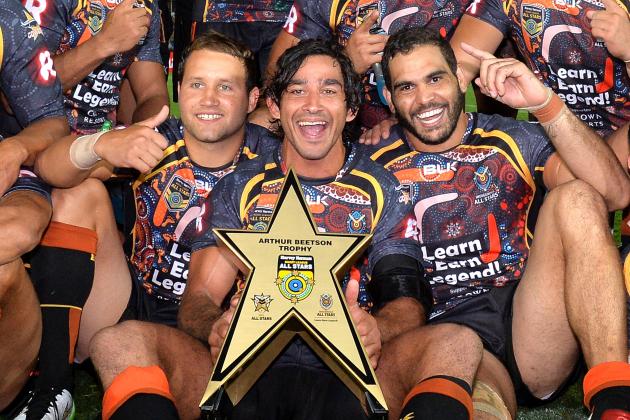 GOLD COAST, AUSTRALIA - FEBRUARY 13: Johnathan Thurston, Greg Inglis and Tyrone Roberts of the Indigenous All Stars celebrate victory after the NRL pre-season match between the Indigenous All Stars and the NRL All Stars at Cbus Super Stadium on February 13, 2015 in Gold Coast, Australia. (Photo by Bradley Kanaris/Getty Images)