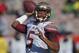 In this Jan. 1, 2015 file photo, Florida State quarterback Jameis Winston passes against Oregon during the first half of the Rose Bowl NCAA college football playoff semifinal, in Pasadena, Calif. Winston declared himself eligible for the NFL draft Wednesday, Jan. 7, 2015, the same day the woman who accused him of rape filed a lawsuit against the university saying it failed to properly investigate her allegations.(AP Photo/Mark J. Terrill, File)