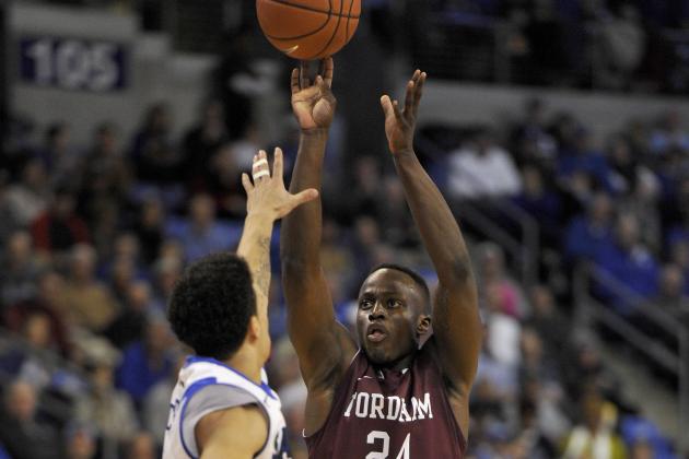 Jan 18, 2014; St. Louis, MO, USA; Fordham Rams guard Bryan Smith (24) shoots the ball while being guarded by Saint Louis Billikens guard Austin McBroom (2) during the second half at Chaifetz Arena. The Saint Louis Billikens defeat the Fordham Rams 70-48. Mandatory Credit: Jasen Vinlove-USA TODAY Sports