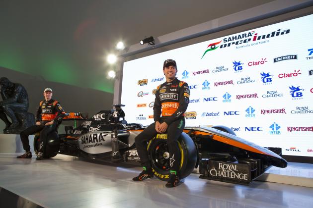 Drivers Sergio Perez, right, and Nico Hulkenberg sit on the newly unveiled Sahara Force India team car, at a press event to announce the 2015 Formula One racing team, at the Soumaya Museum in Mexico City, Wednesday, Jan. 21, 2015. (AP Photo/Rebecca Blackwell)