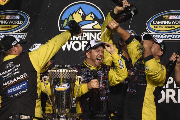 HOMESTEAD, FL - NOVEMBER 14:  Matt Crafton, driver of the #88 Jeld-Wen/Menards Toyota, and his team celebrate with champagne in Victory Lane after winning the series championship during the NASCAR Camping World Truck Series Ford EcoBoost 200 at Homestead-Miami Speedway on November 14, 2014 in Homestead, Florida.  (Photo by Patrick Smith/Getty Images)
