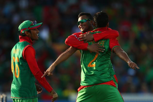 CANBERRA, AUSTRALIA - FEBRUARY 18:  Bangladesh captain Mashrafe Bin Mortaza is congratulated by team mates after dismissing Ashar Stanekzai of Afghanistan during the 2015 ICC Cricket World Cup match between Bangladesh and Afghanistan at Manuka Oval on February 18, 2015 in Canberra, Australia.  (Photo by Cameron Spencer/Getty Images)