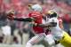 Nov 29, 2014; Columbus, OH, USA; Ohio State Buckeyes wide receiver Devin Smith (9) pulls in a pass in front of Michigan Wolverines defensive back Raymon Taylor (6) at Ohio Stadium. Mandatory Credit: Greg Bartram-USA TODAY Sports