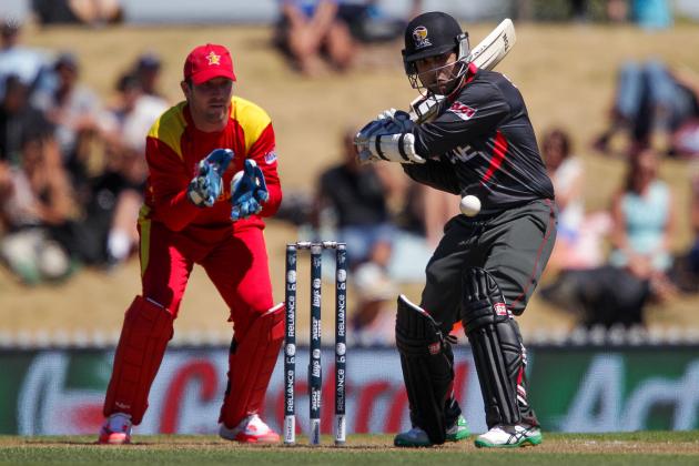 NELSON, NEW ZEALAND - FEBRUARY 19:  Shaiman Anwar of the United Arab Emirates bats while Brendan Taylor of Zimbabwe looks on during the 2015 ICC Cricket World Cup match between Zimbabwe and the United Arab Emirates at Saxton Field on February 19, 2015 in Nelson, New Zealand.  (Photo by Hagen Hopkins/Getty Images)