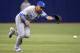 Toronto Blue Jays second baseman Maicer Izturis misses on a line drive single hit by Tampa Bay Rays' Ben Zobrist in the third inning of a baseball game in St. Petersburg, Fla., Thursday, April 3, 2014. (AP Photo/Phelan M. Ebenhack)