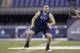 Iowa offensive lineman Brandon Scherff runs a drill at the NFL football scouting combine in Indianapolis, Friday, Feb. 20, 2015. (AP Photo/David J. Phillip)