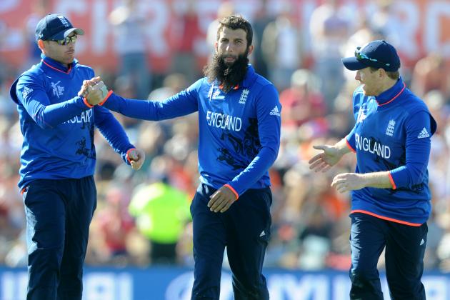 England's Moeen Ali centre, is congratulated by teammates Ian Bell left, and Eoin Morgan after taking the wicket of Scotland's Richie Berrington during their Cricket World Cup match in Christchurch, New Zealand, Monday, Feb. 23, 2015. (AP Photo Ross Setford)
