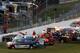 Safety workers and emergency personnel attend to Kyle Busch after his wreck.