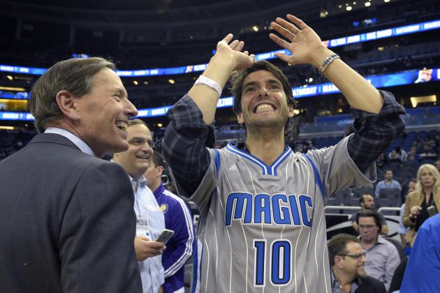Brazilian professional soccer player Kaka, right, shows his shooting form while talking with Orlando Magic Chairman Dan DeVos before an NBA basketball game against the New York Knicks in Orlando, Fla., Wednesday, Feb. 11, 2015.(AP Photo/Phelan M. Ebenhack)