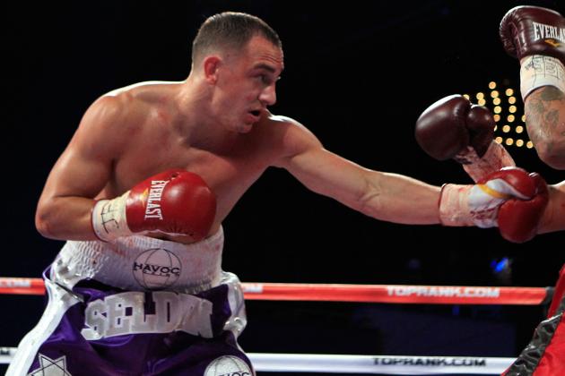 NEW YORK, NY - OCTOBER 22:  (L-R) Cletus Seldin punches Jose Segura during a welterweight bout at Madison Square Garden on October 22, 2011 in New York City.  (Photo by Chris Trotman/Getty Images)
