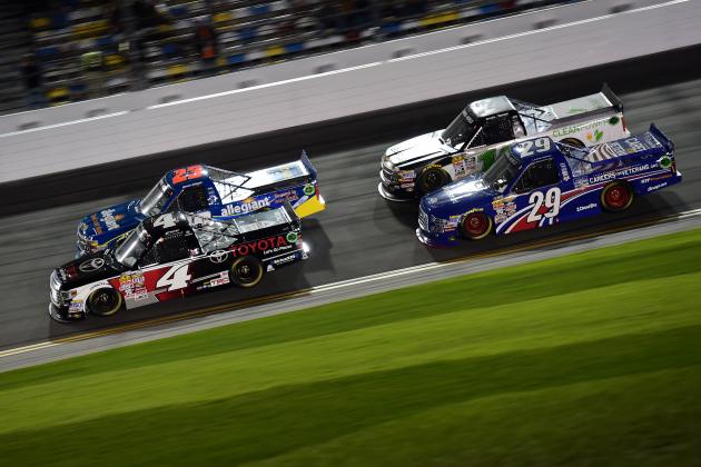 DAYTONA BEACH, FL - FEBRUARY 20:  Erik Jones, driver of the #4 Toyota Toyota, Spencer Gallagher, driver of the #23 Allegiant Travel Chevrolet, Austin Theriault, driver of the #29 Cooper Standard Careers for Veterans Ford, and Daniel Hemric, driver of the #14 California Clean Power Chevrolet, race during the NASCAR Camping World Truck Series NextEra Energy Resources 250 at Daytona International Speedway on February 20, 2015 in Daytona Beach, Florida.  (Photo by Robert Laberge/Getty Images)