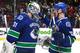 VANCOUVER, BC - MARCH 19: Eddie Lack #31 of the Vancouver Canucks is congratulated by teammate Henrik Sedin #33 during their NHL game against the Nashville Predators at Rogers Arena March 19, 2014 in Vancouver, British Columbia, Canada. Vancouver won 2-0. (Photo by Jeff Vinnick/NHLI via Getty Images)