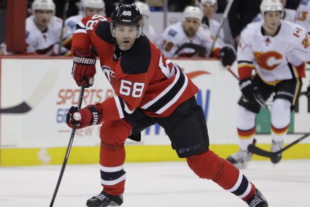 New Jersey Devils right wing Jaromir Jagr, of the Czech Republic, skates against the Calgary Flames during the second period of an NHL hockey game, Wednesday, Feb. 25, 2015, in Newark, N.J. (AP Photo/Julio Cortez)