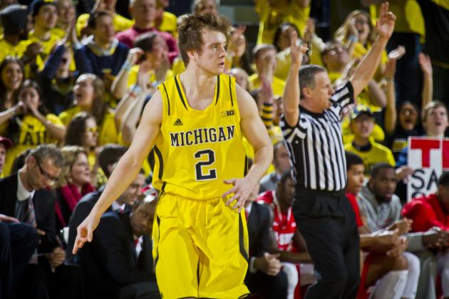 Michigan guard Spike Albrecht (2) reacts to scoring a 3-point basket in the first half of an NCAA college basketball game against Ohio State at Crisler Center in Ann Arbor, Mich., Sunday, Feb. 22, 2015. (AP Photo/Tony Ding)