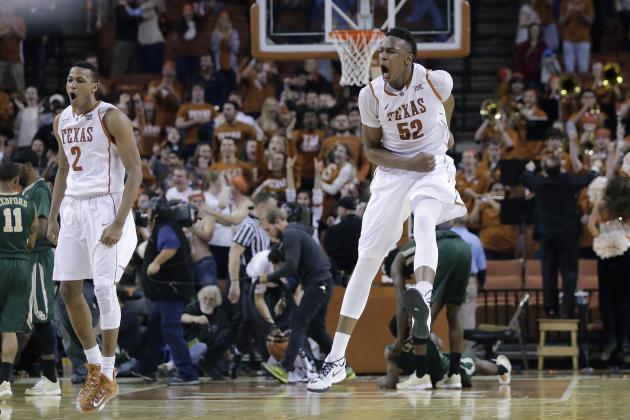 Texas’ Myles Turner (52) celebrates with teammates after he blocked a shot in the final seconds of overtime in an NCAA college basketball game against Baylor, Monday, March 2, 2015, in Austin, Texas. Texas won 61-59.(AP Photo/Eric Gay)