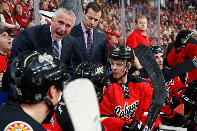 CALGARY, AB - FEBRUARY 14: Head coach Bob Hartley of the Calgary Flames gives instructions to his players during a stoppage in play against the Vancouver Canucks at Scotiabank Saddledome on February 14, 2015 in Calgary, Alberta, Canada. (Photo by Gerry Thomas/NHLI via Getty Images)