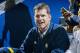 Michigan football head coach Jim Harbaugh attends an NCAA college basketball game against Northwestern at Crisler Center in Ann Arbor, Mich., Saturday, Jan. 17, 2015. (AP Photo/Tony Ding)