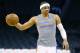 Oklahoma City Thunder guard Russell Westbrook warms up before an NBA basketball game between the Philadelphia 76ers and the Oklahoma City Thunder in Oklahoma City, Wednesday, March 4, 2015. Westbrook is wearing a clear protective mask to shield an injury to his zygomatic arch. (AP Photo/Sue Ogrocki)