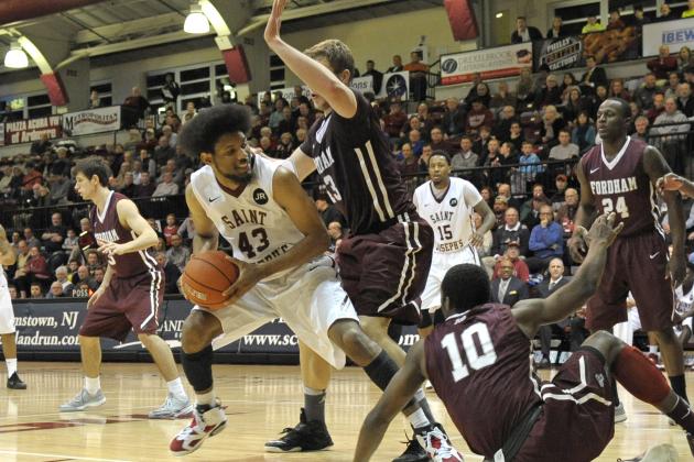 Jan 14, 2015; Philadelphia, PA, USA; Saint Joseph's Hawks forward DeAndre Bembry (43) battles with Fordham Rams forward Christian Sengfelder (43) and  guard Jon Severe (10) during the second half at Hagan Arena. The Hawks defeated the Rams, 66-55. Mandatory Credit: Eric Hartline-USA TODAY Sports