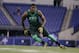 Nebraska defensive lineman Randy Gregory runs a drill at the NFL football scouting combine in Indianapolis, Sunday, Feb. 22, 2015. (AP Photo/David J. Phillip)
