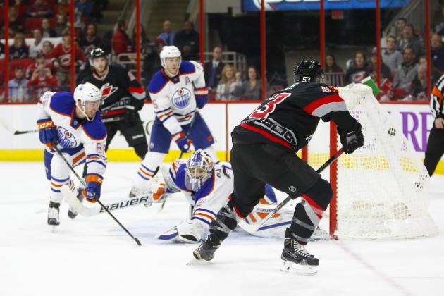 Mar 8, 2015; Raleigh, NC, USA; Carolina Hurricanes forward Jeff Skinner (53) scores a 2nd period goal past the Edmonton Oilers goalie Richard Bachman (32) and defensemen Martin Marincin (85) at PNC Arena. Mandatory Credit: James Guillory-USA TODAY Sports